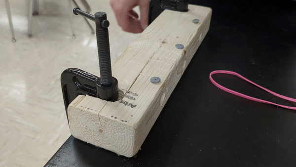 Animation of attaching rubber band to baseboard